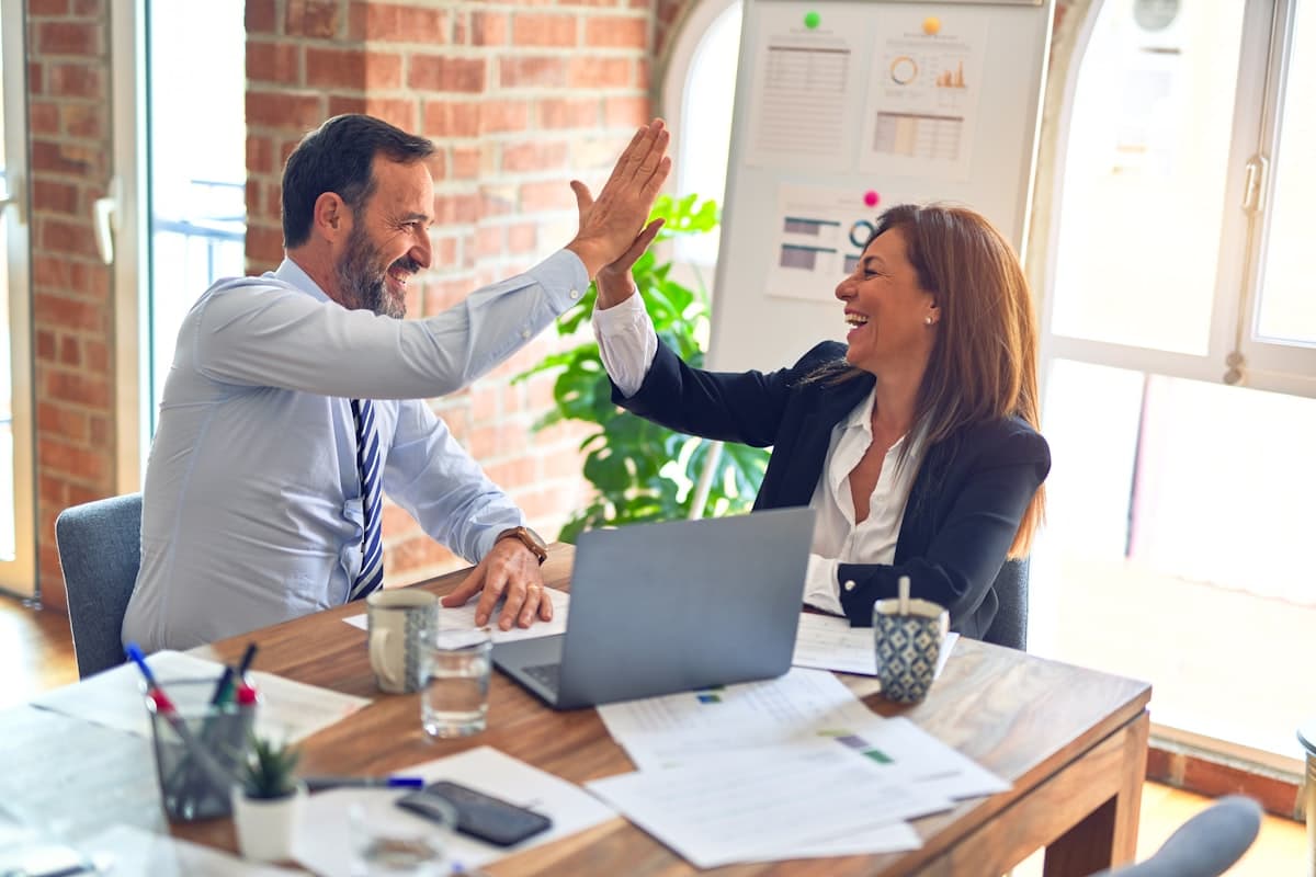 Business professionals collaborating in a modern meeting room, representing transparent partnership
